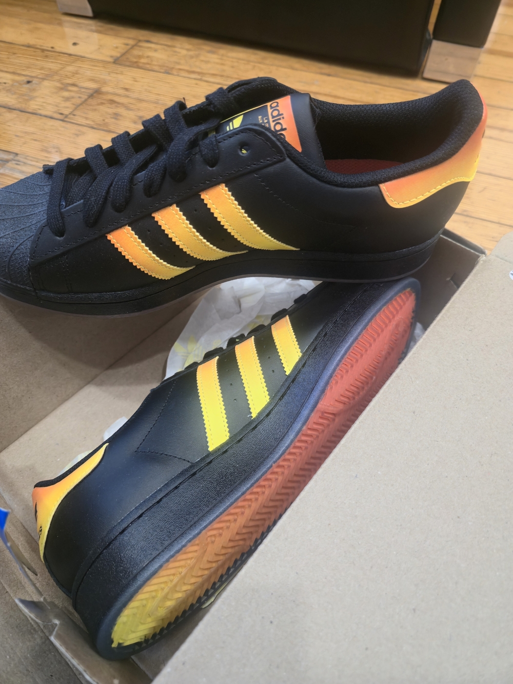 adidas Black Sneakers with Yellow-Orange Gradient Stripes